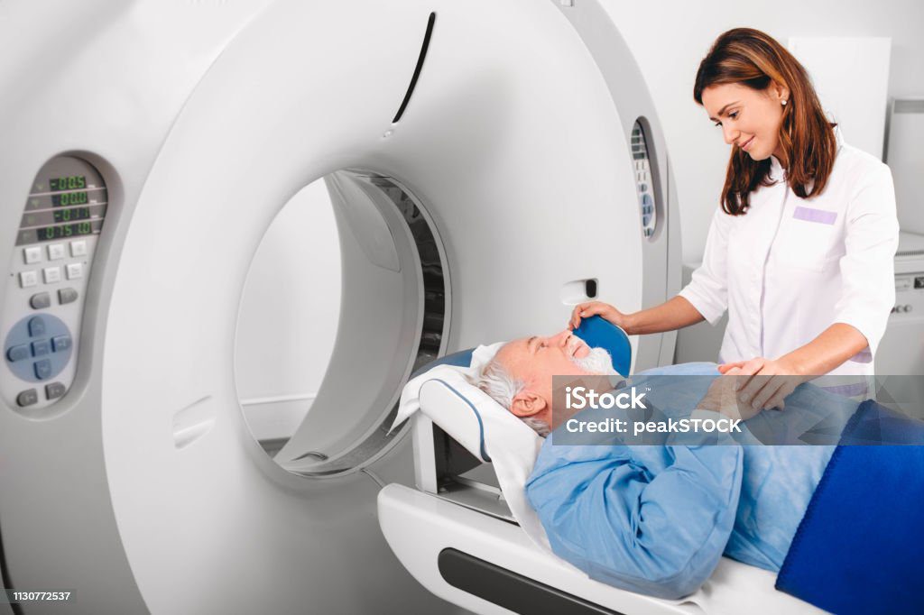 Nuclear Medicine Technologist with PET Scanner